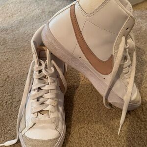 Nike Blazers Women’s White Leather with pink Swoosh.  Great used condition!